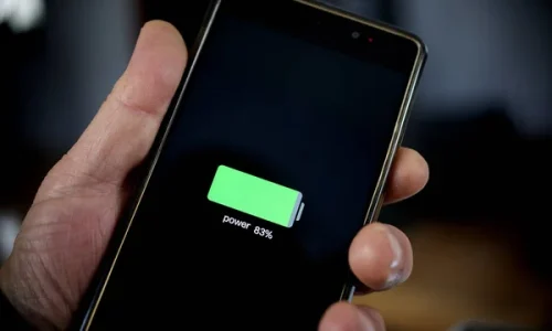 depositphotos_330117460-stock-photo-hand-holding-smartphone-showing-battery